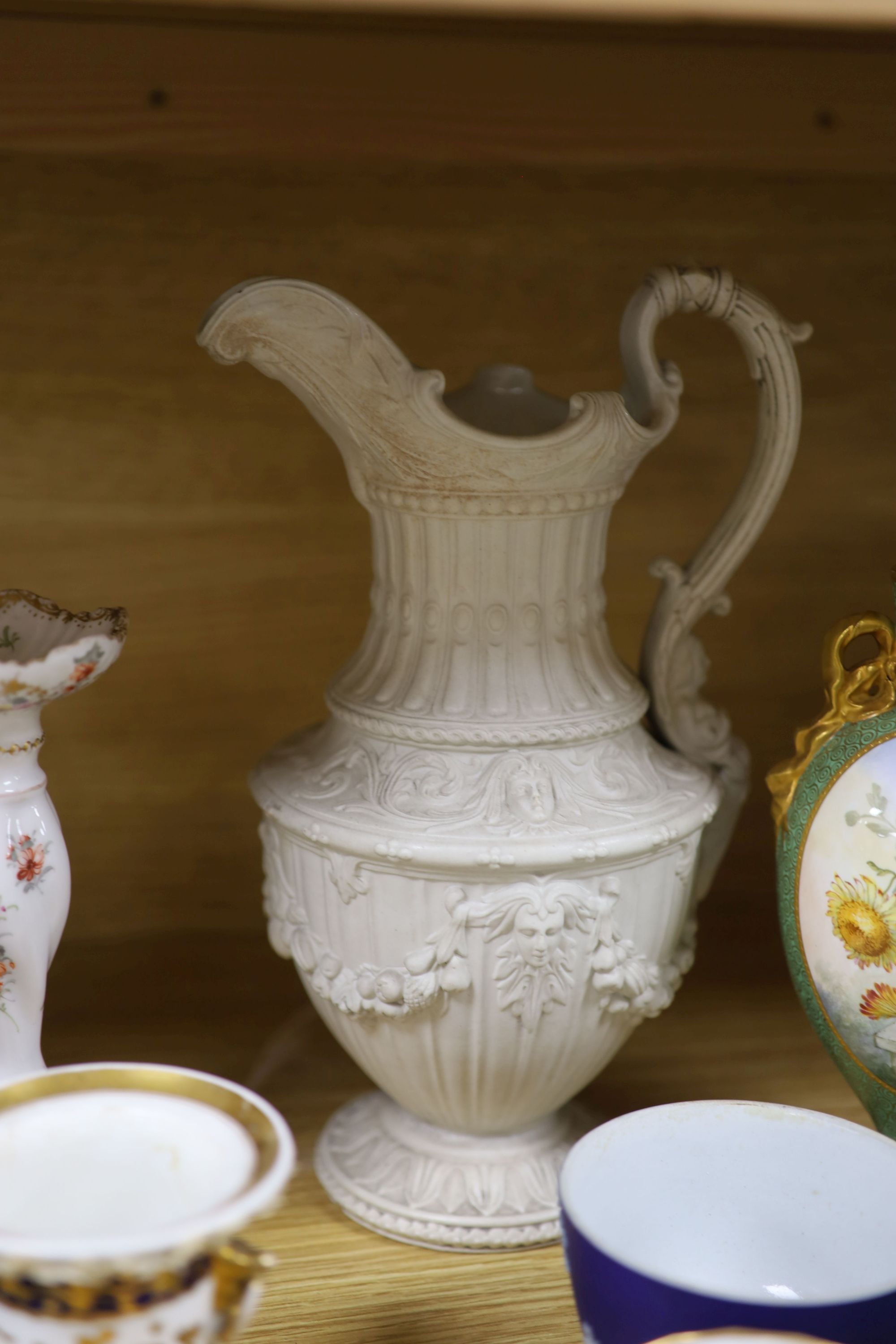 A group of mixed ceramics including a Copeland flower-painted vase, a Staffordshire hen and chick tureen and cover, Staffordshire cot